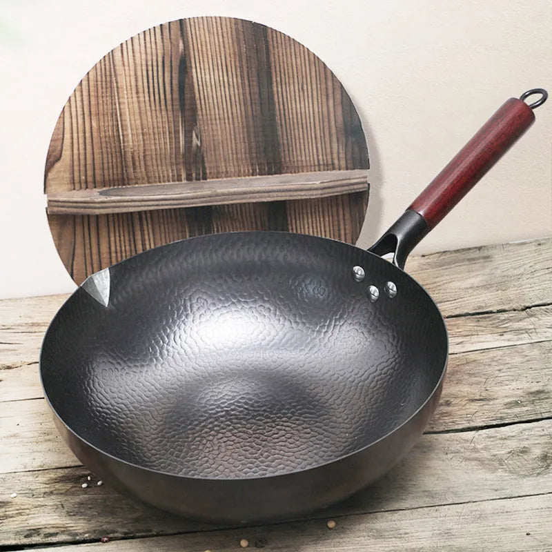 Traditional black iron wok with long wooden handle, 32cm cooking surface