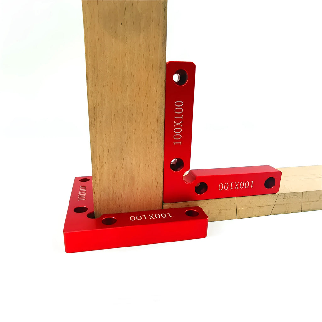 Aluminium alloy right angle woodworking positioning block on a workbench.