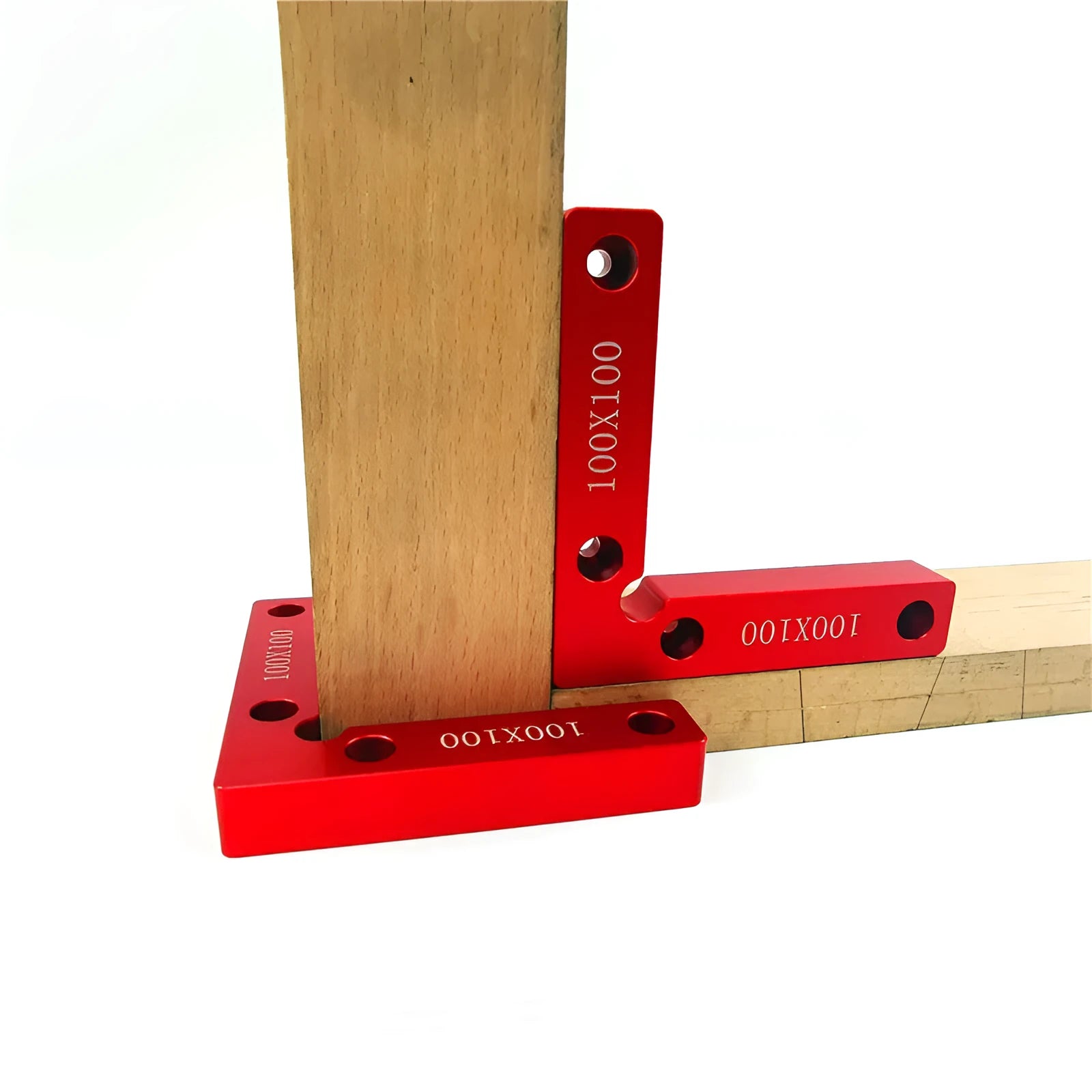 Aluminium alloy right angle woodworking positioning block on a workbench.