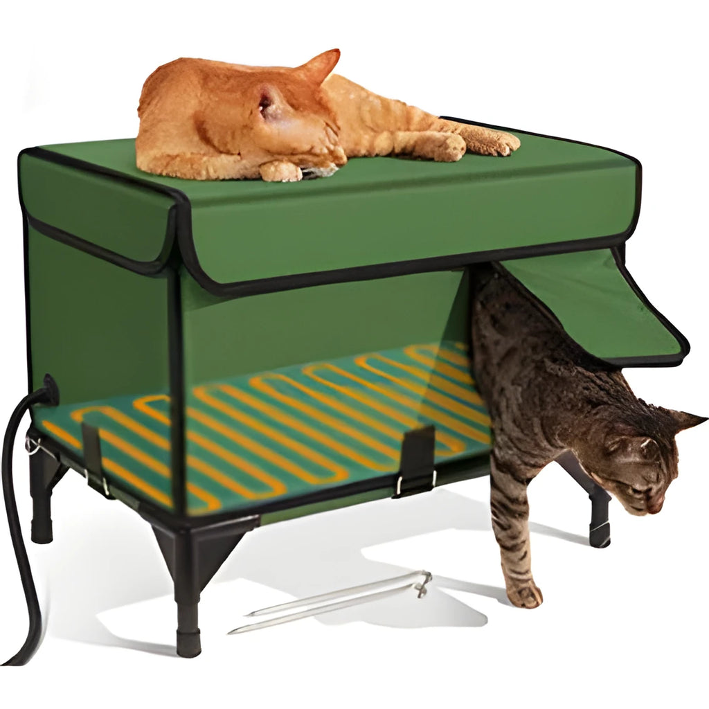 Green foldable cat cage with removable cloth cover, shown in a garden setting.