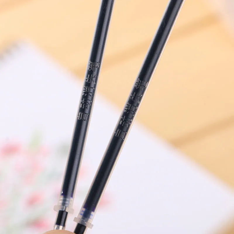 Automatic fade pen set showing pen holder, case, and eight refill units for temporary marking.