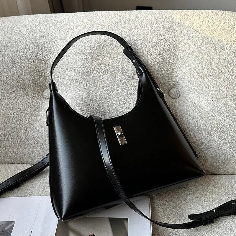 Genuine cowhide leather crossbody shoulder bag in dumpling shape with organised internal compartments