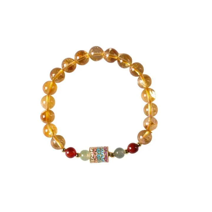 Yellow citrine bracelet with prayer wheel charms and 8mm round beads