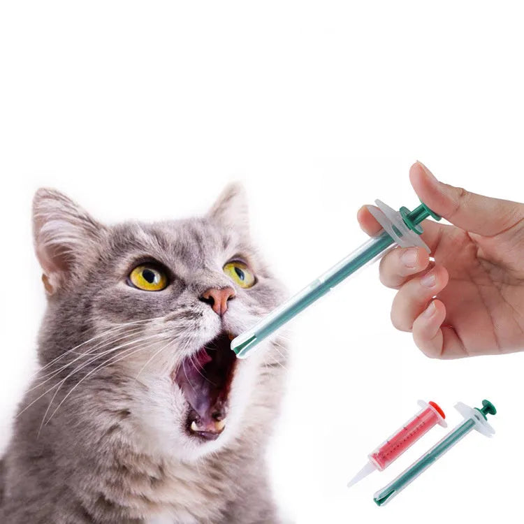 Two soft-tip pet pill shooter syringes for cats and dogs on a white background.
