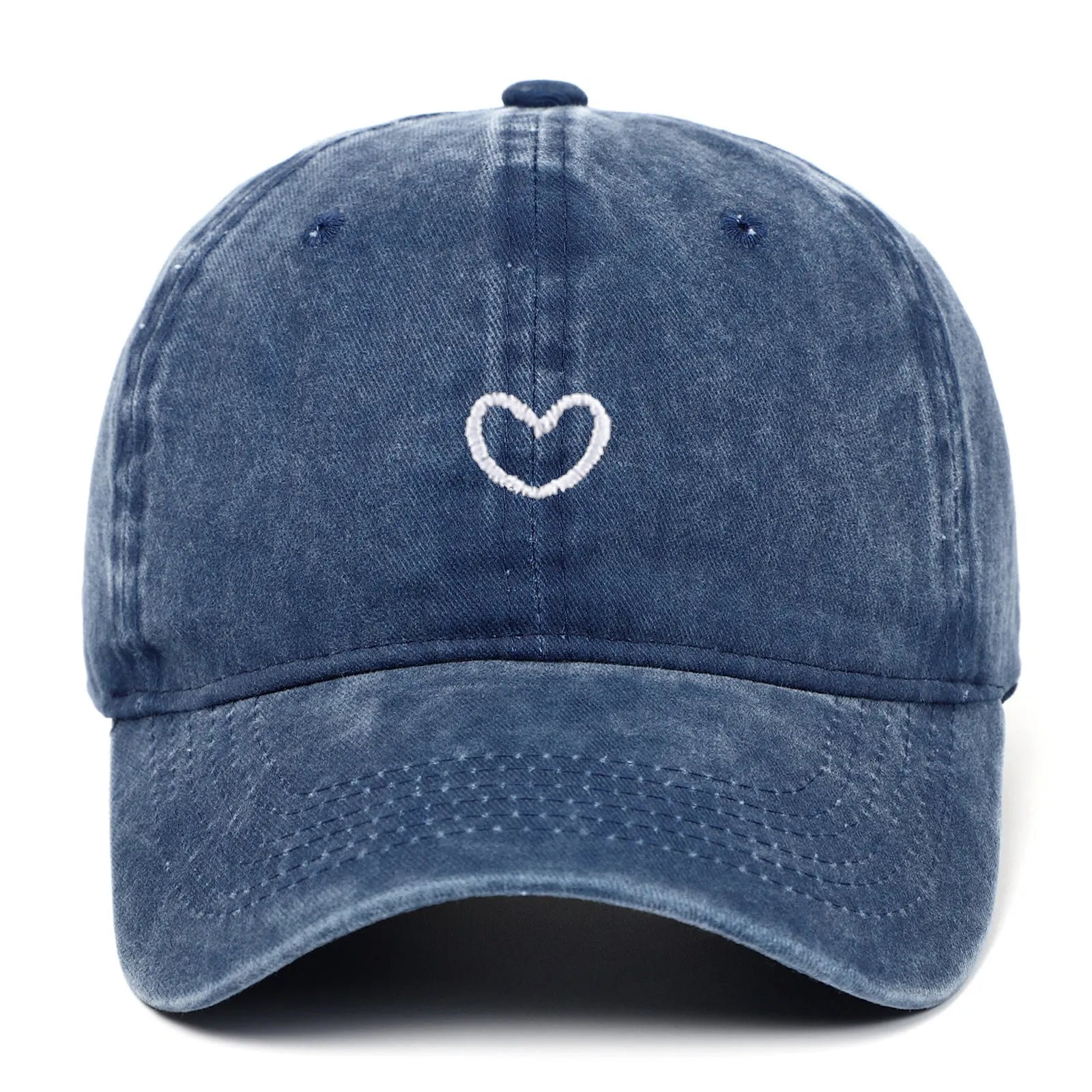 Adjustable cotton baseball cap featuring a distressed embroidered love heart on the front, shown in a selection of colours.