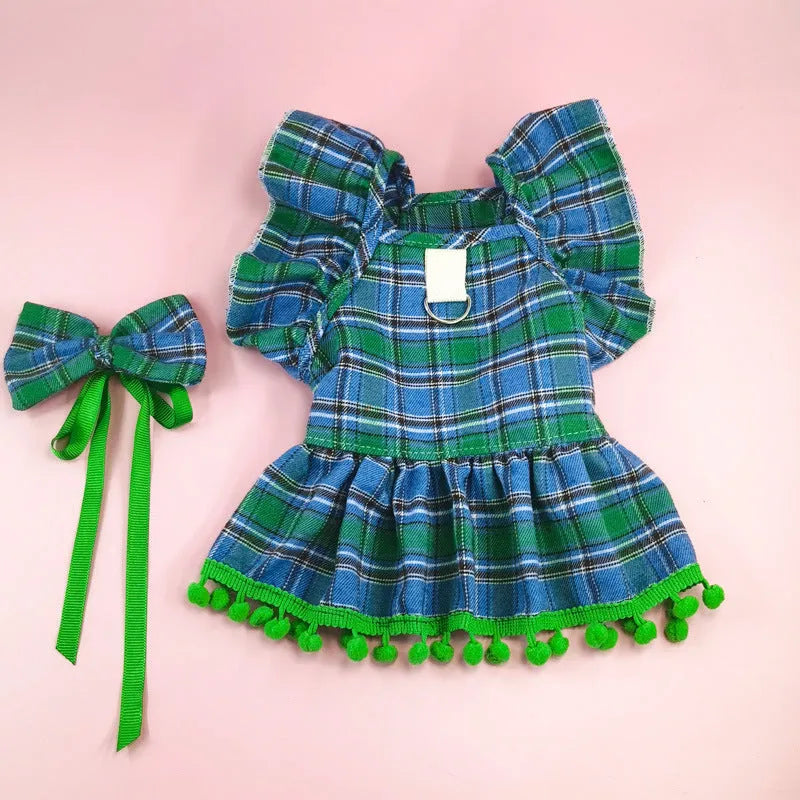 Red tartan Christmas skirt outfit with bow tie and head flower on a small dog or cat.