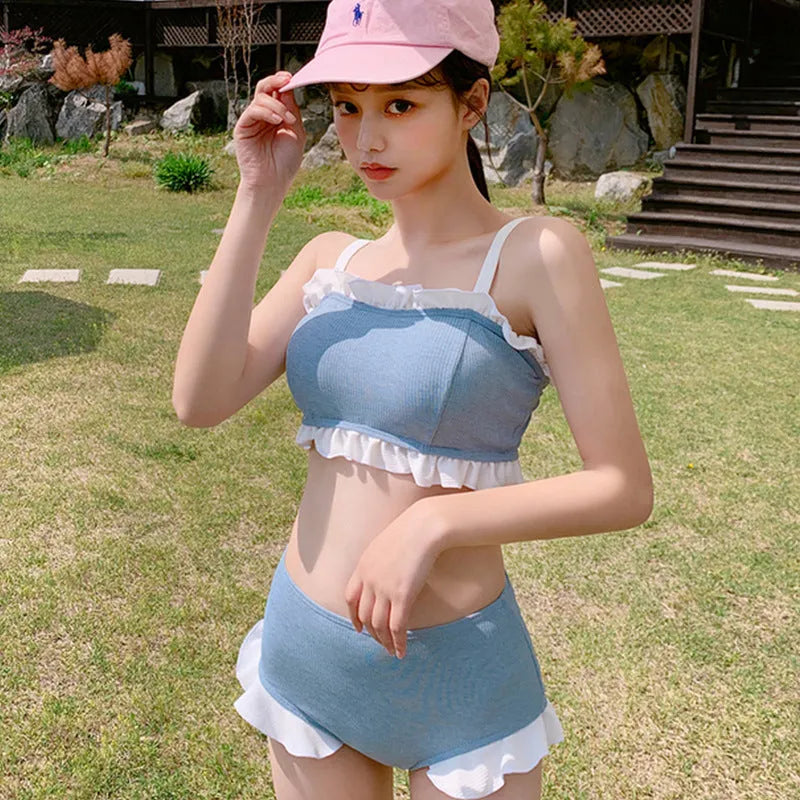 Solid colour conservative one-piece swimsuit for women with adjustable suspenders.