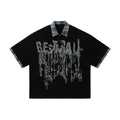 Men's loose blue cotton top with asymmetric cut and graffiti print on lapel.