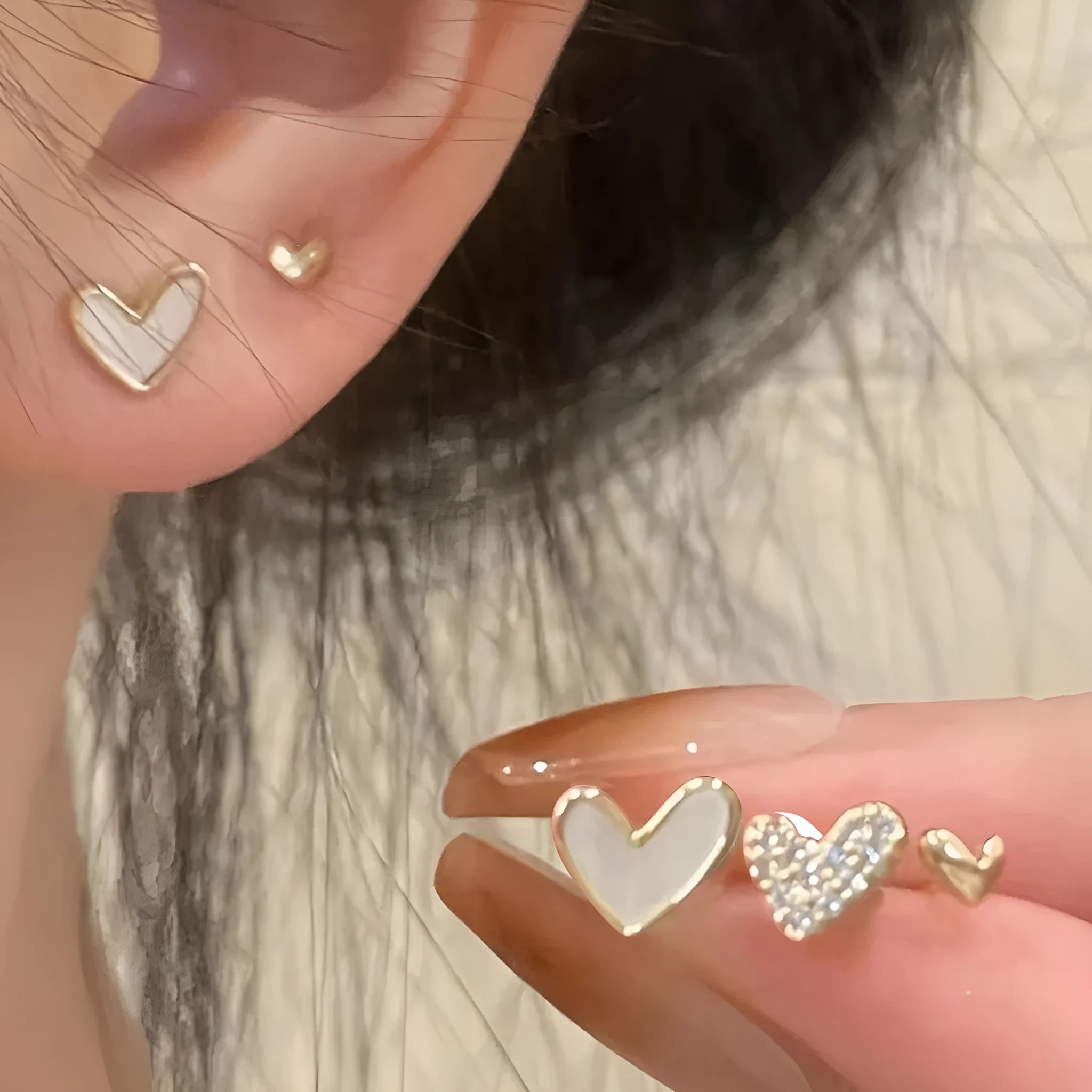 Women's heart shape earrings suit with three pairs in gold, black, black white, and pink colours