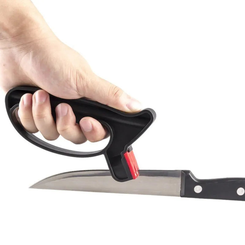 Black handheld knife and scissor sharpener showing ergonomic handle and sharpening slots on a white background.
