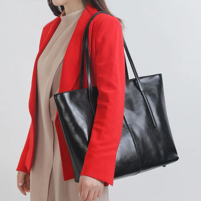 Women's soft cowhide leather shoulder bag in retro brown colour showing external slit pocket and single strap.
