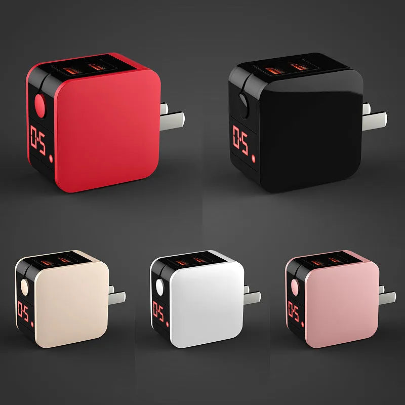 Black 5V 2.4A dual USB travel charger with digital display and a UK plug on a white background.