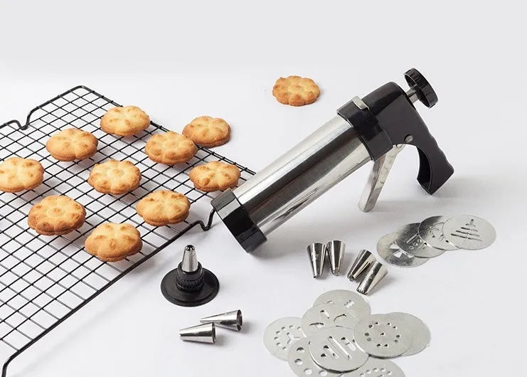 Stainless steel biscuit press machine with cookie moulds and piping nozzles in a gift box.