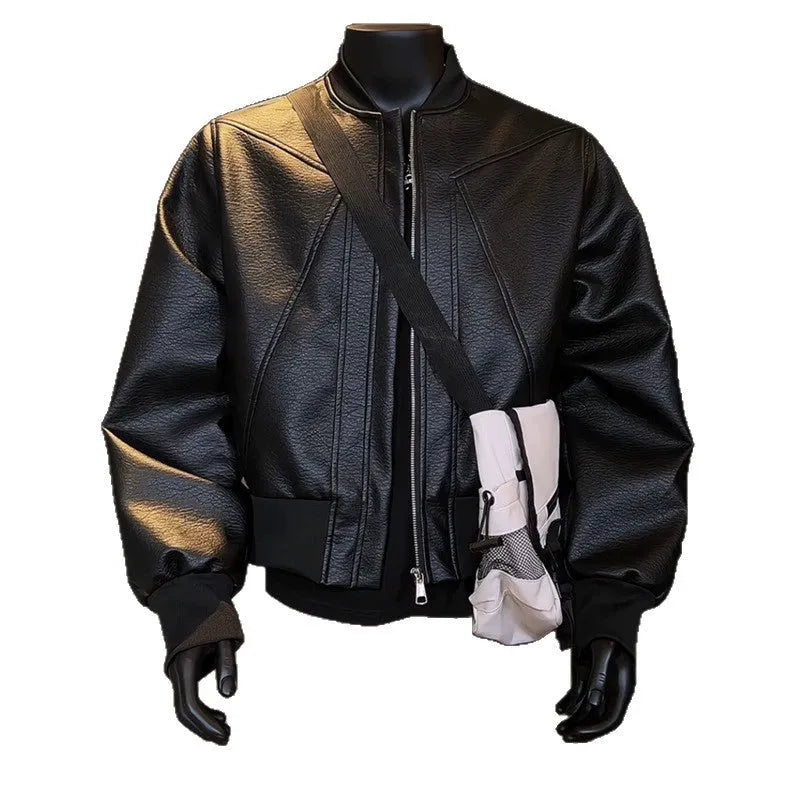 Man wearing a black slim-fit PU leather jacket with litchi grain texture and extended length.