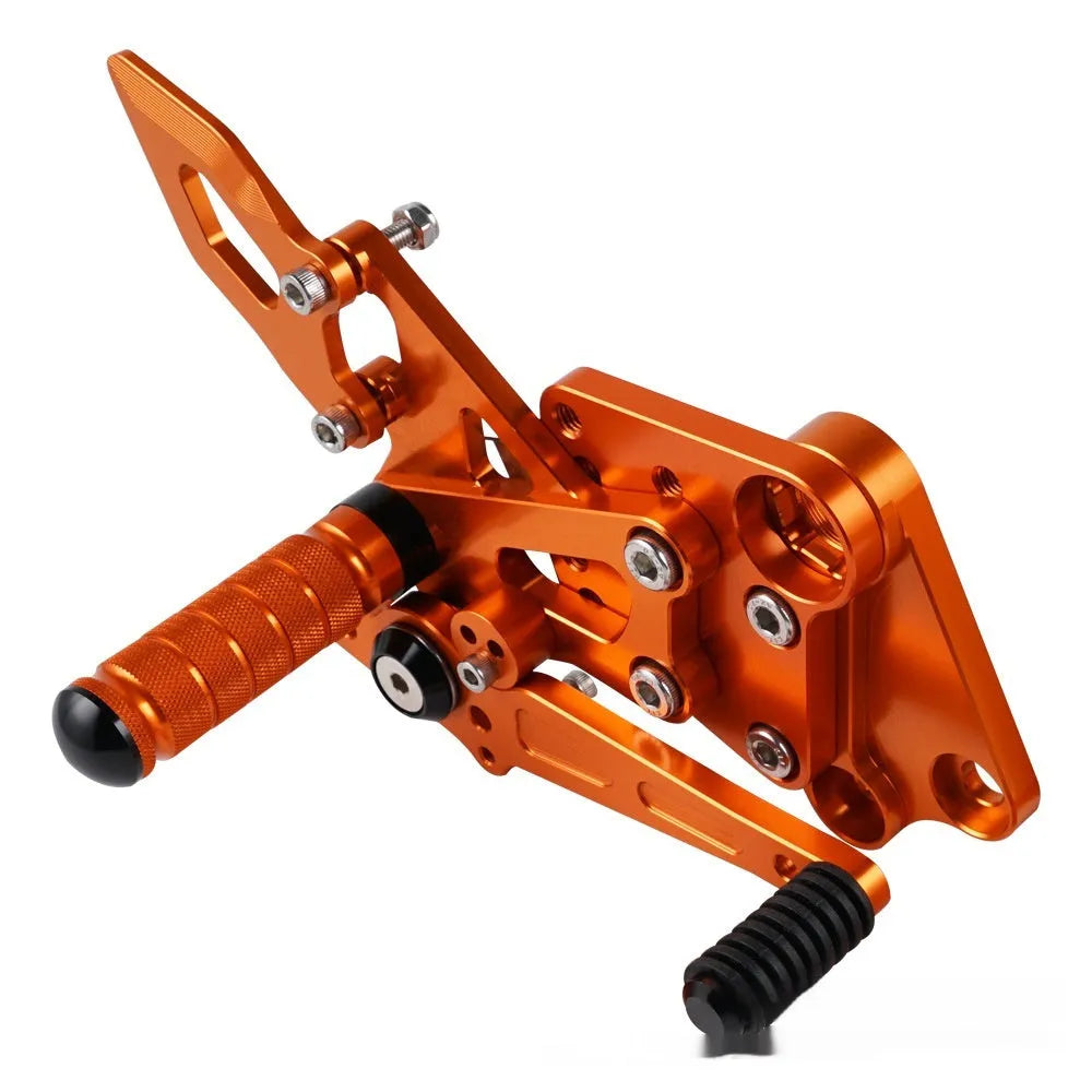 KTM Duke rear shift pedal support assembly bracket in black or orange for 125 200 250 390 models