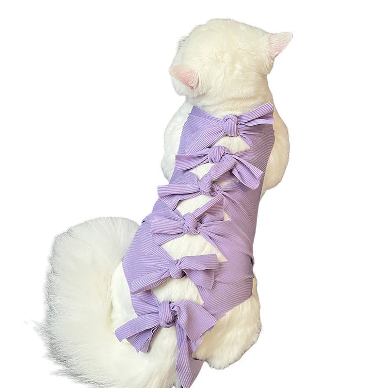 Lace-up polyester cat recovery suit in blue colour shown on a model, size L for cats 6-9kg.