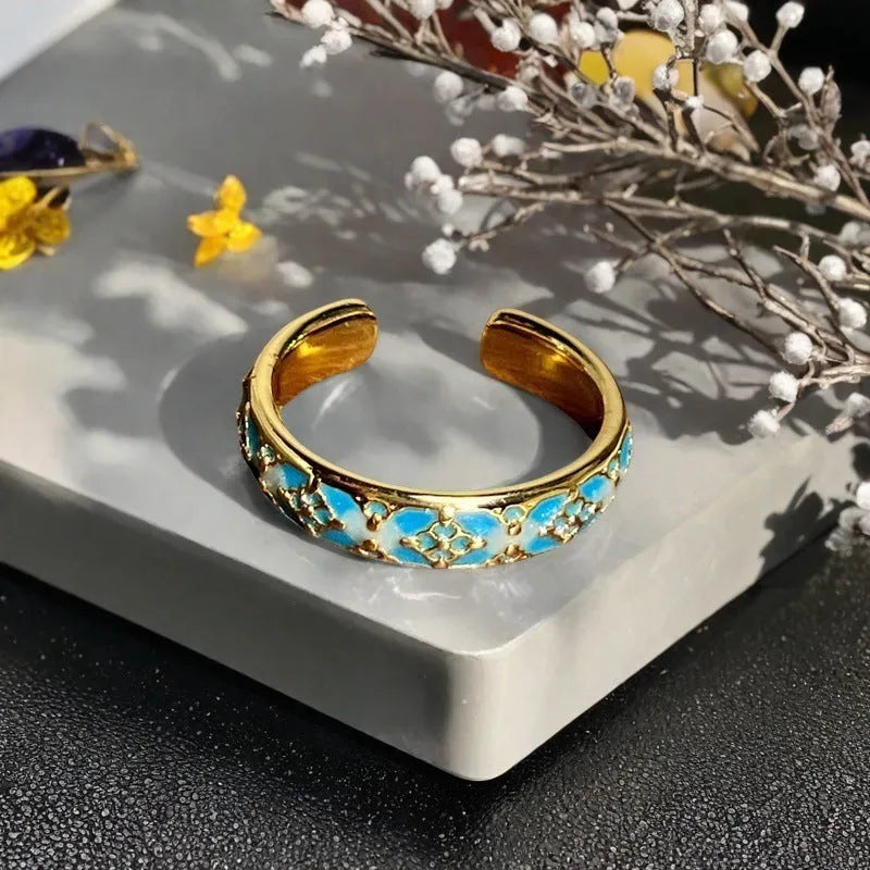 Adjustable copper ring with New Chinese style gourd, flower, and bow design in a vintage oil drip pattern.