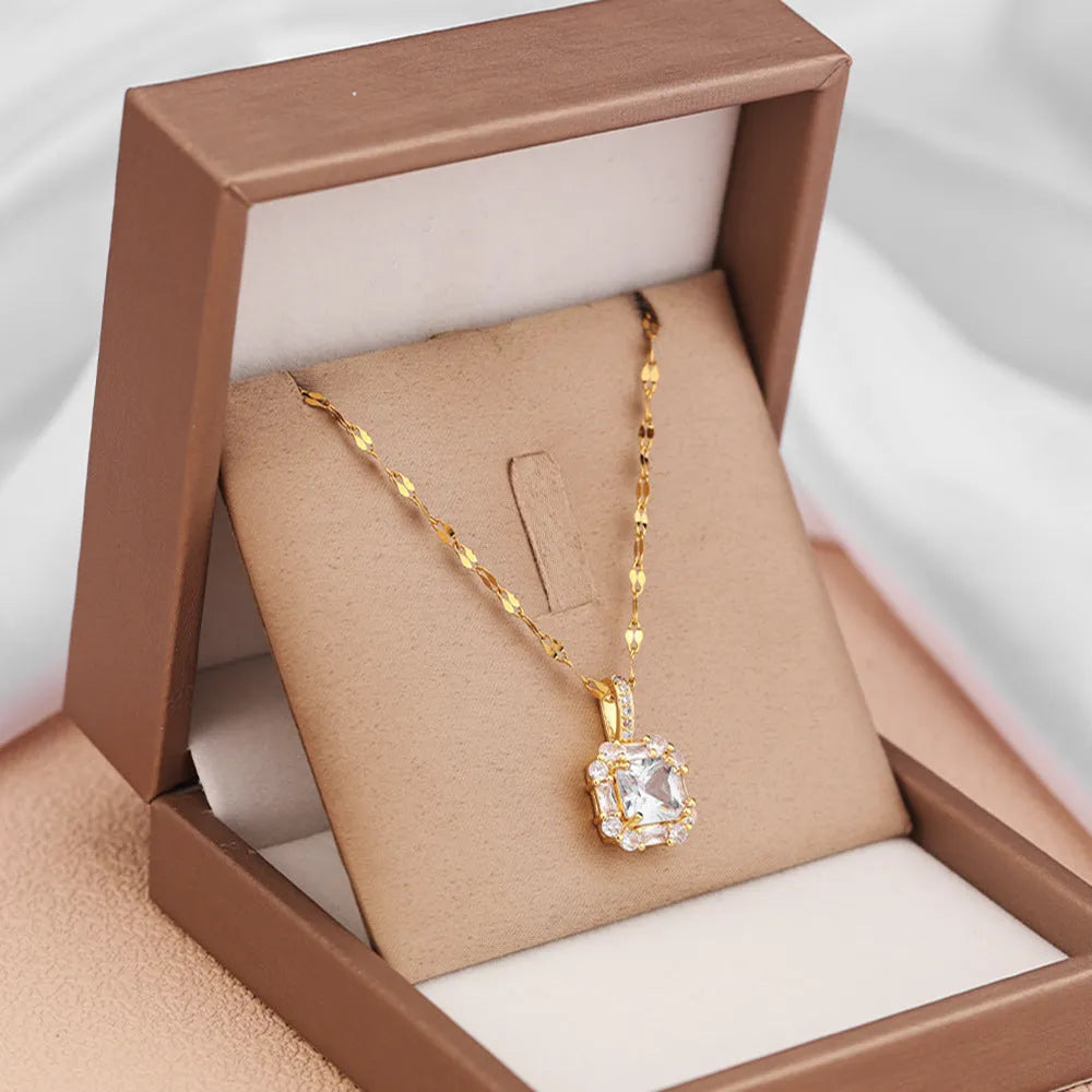 Gold geometric zircon clavicle necklace on titanium steel water wave chain.