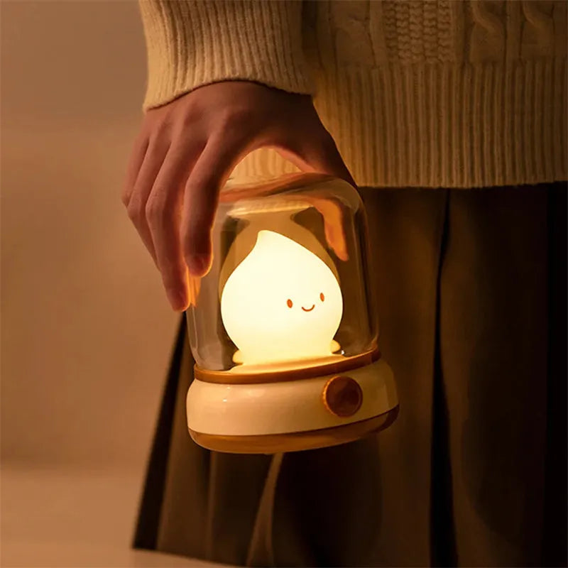 Green retro-style USB rechargeable LED night lamp with dimmer knob on wooden table