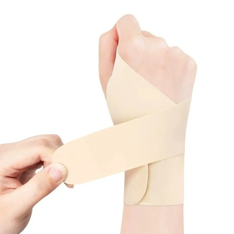 Adjustable black athletic wristguard for wrist support during sports like tennis and badminton.