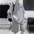 Men's cotton polyester waffle texture short sleeve top and shorts leisure sports suit set on a hanger.