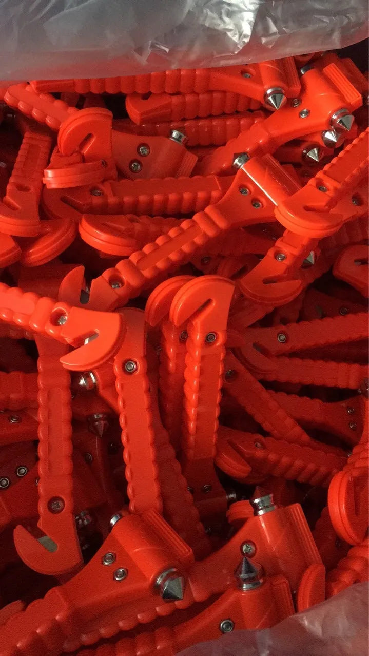 Red car life saving hammer with ABS carbon steel construction and integrated seatbelt cutter
