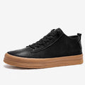 Men's black casual leather shoes with a round toe and lace-up front on a white background.