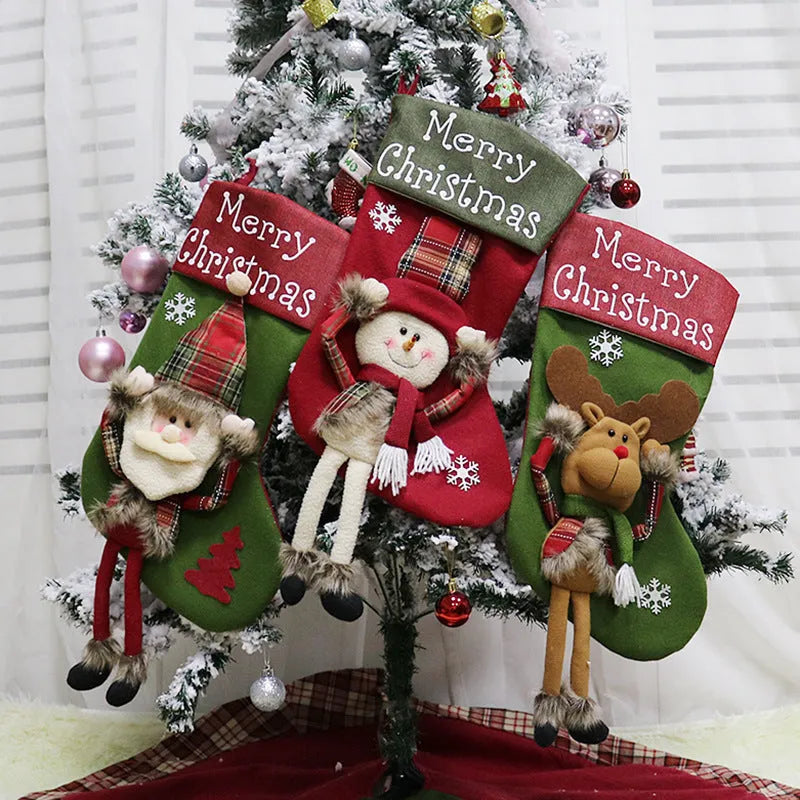Three large Christmas stockings featuring Santa, Snowman and Reindeer designs with 3D applique decorations