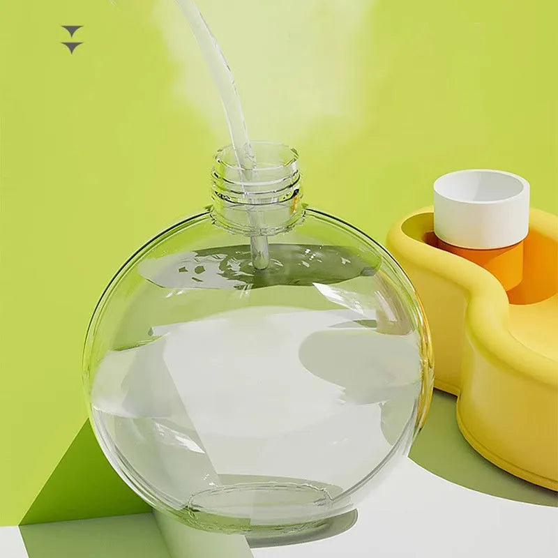 Green portable pet travel water bottle with pull-out drinking bowl for dogs, shown with size dimensions.