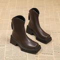 Black women's platform Martin ankle boots with square toe, back zipper, and a 6-8cm heel.