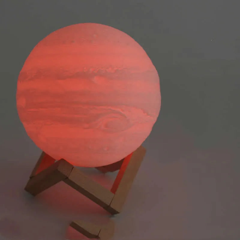 3D printed spherical moon lamp showing lunar surface texture on wooden holder