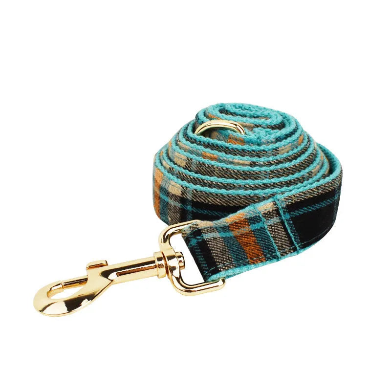 Green retro dog collar and leash four-piece set with matching vest and bow on cloth fabric