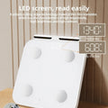 White intelligent body fat scale with 8 electrodes and a tempered glass platform.