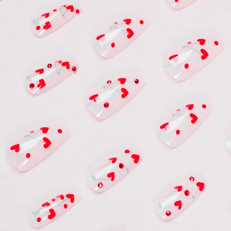 JP1601 style false nail appliqués with French manicure, red cherry and gold diamond designs, 24-piece pack with glue