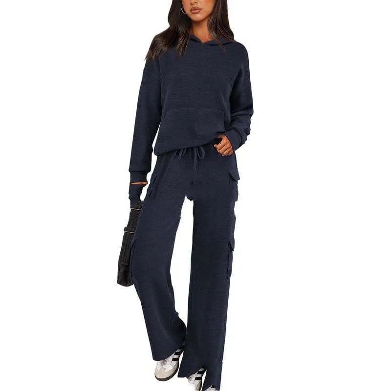 Women's black polyester leisure sportswear set featuring a long sleeve top and matching trousers on a hanger.