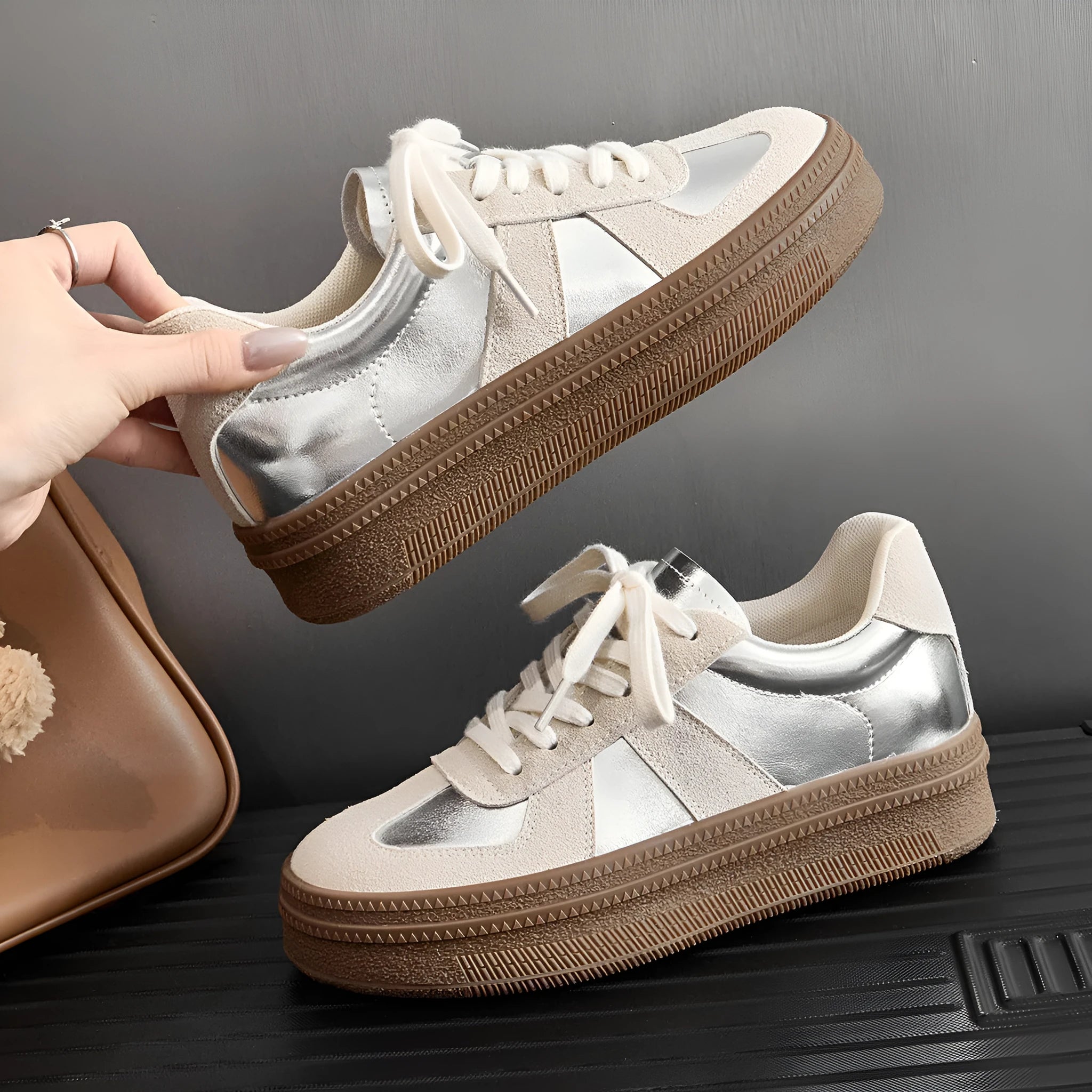 Retro sports board shoes with cross shoulder straps in milky white colour showing round toe and lace-up design