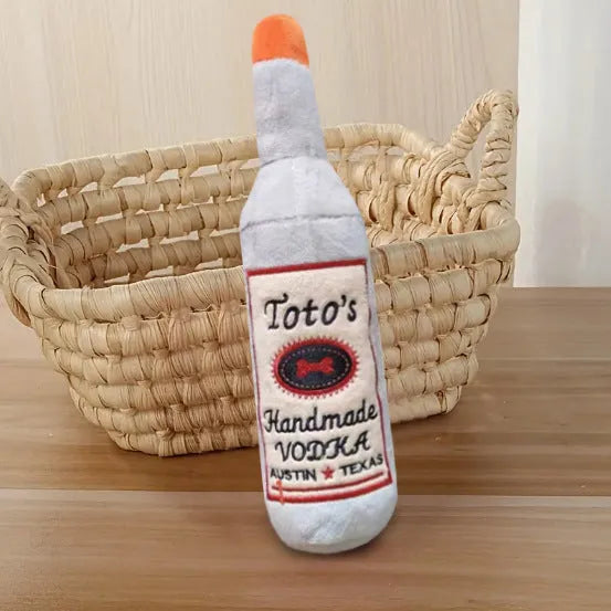 Brown plush wine bottle shaped dog chew toy for dental cleaning and interactive play