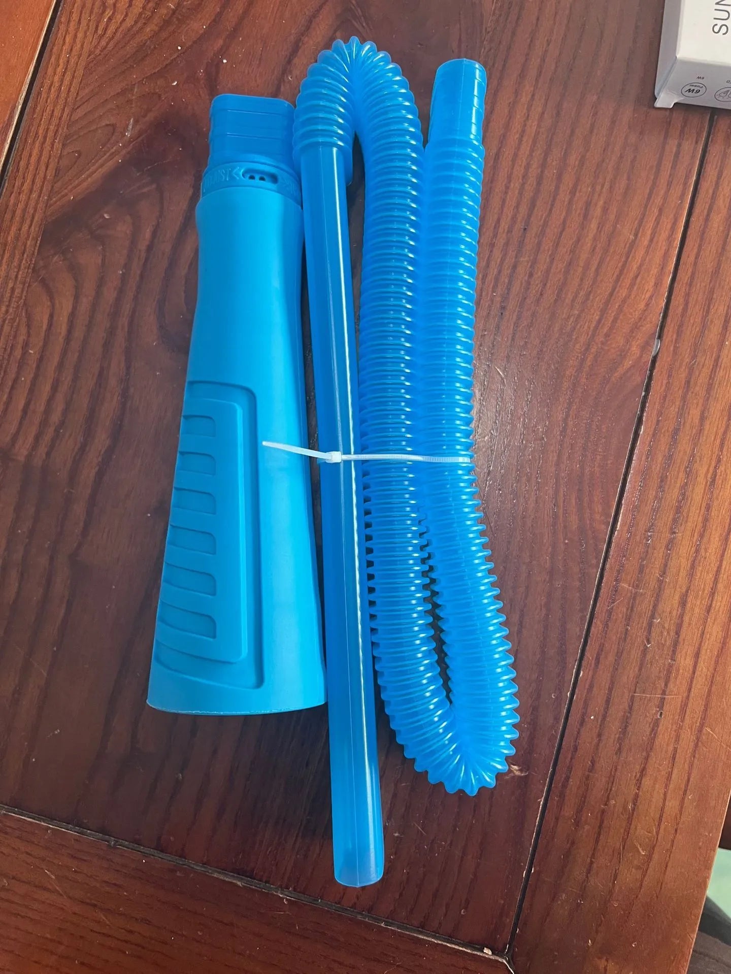 Blue plastic suction pipe cleaner with a round head, 114cm long, for washing machine and dryer lint removal.