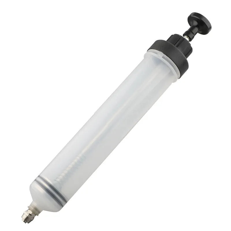 Manual oil pump syringe tool with suction and injection ports for fluid transfer