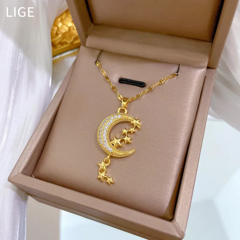 Geometric moon pendant necklace on a stainless steel chain with a copper accent.
