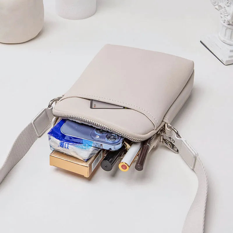 Small solid colour PU leather crossbody shoulder bag for mobile phone in beige.