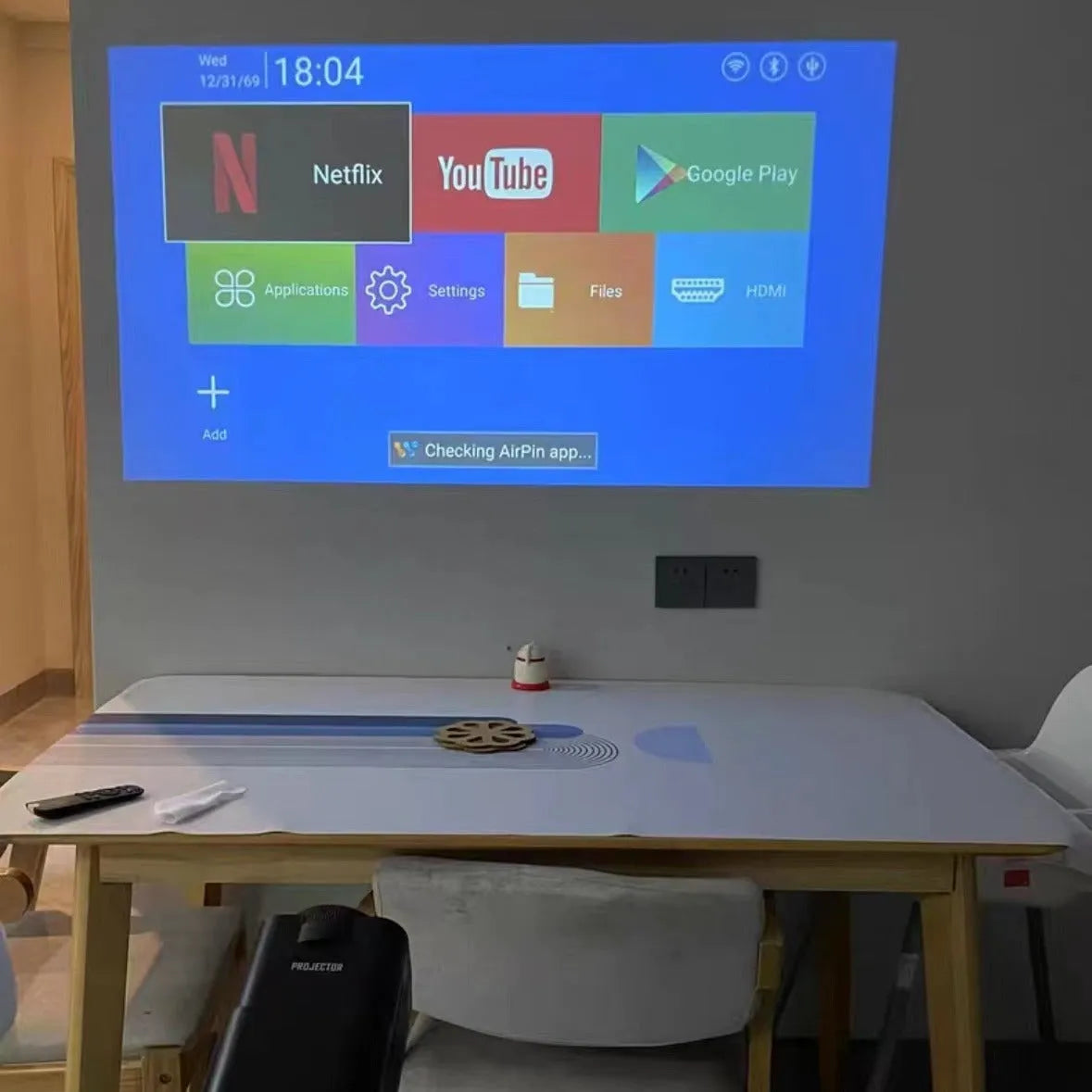 720p wireless home projector unit on a table