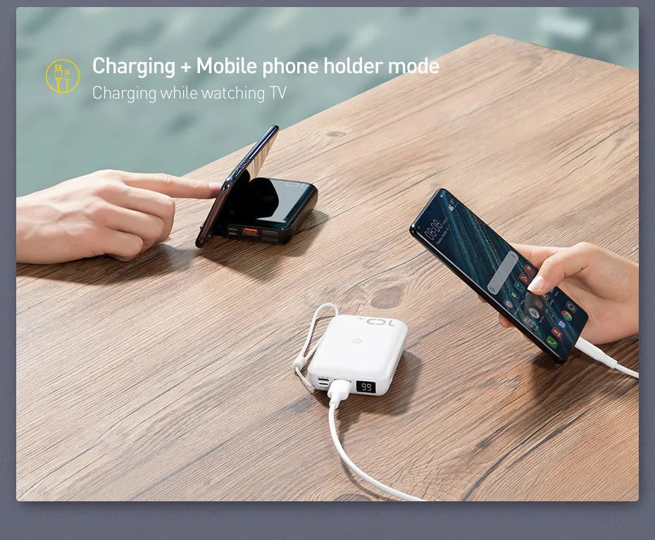 Small square black wireless fast charging power bank with digital display showing battery percentage
