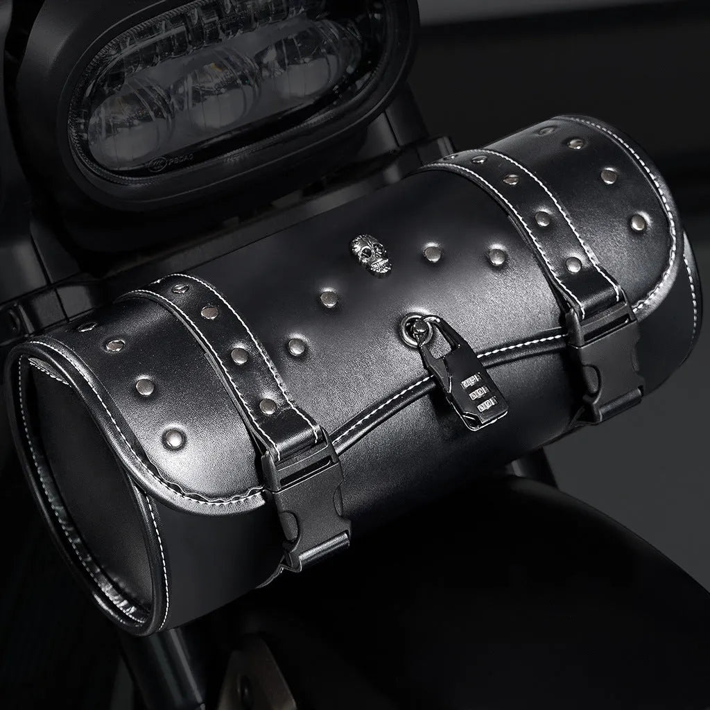 Black punk-style motorcycle pannier bag made from PU leather mounted on a bike.