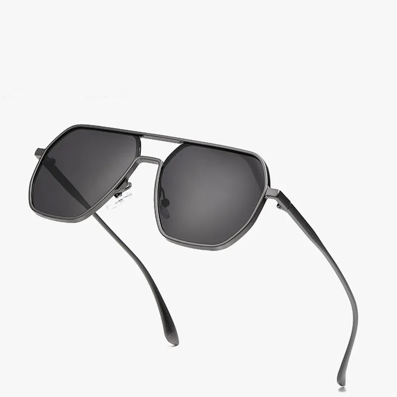 Polarised sunglasses for men in black frame with grey lenses, suitable for driving and UV protection.