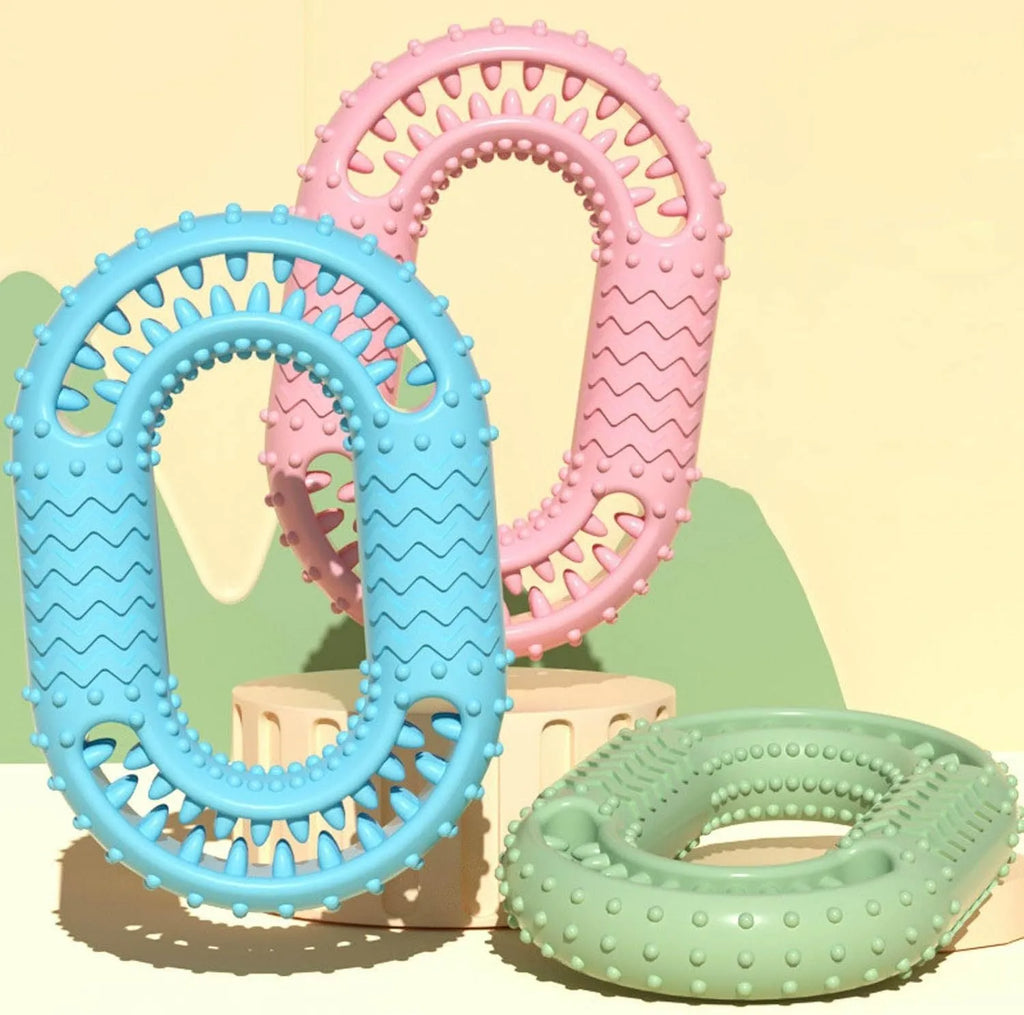 Blue O-ring shaped dog chewing toy for large breed aggressive chewers on a plain background