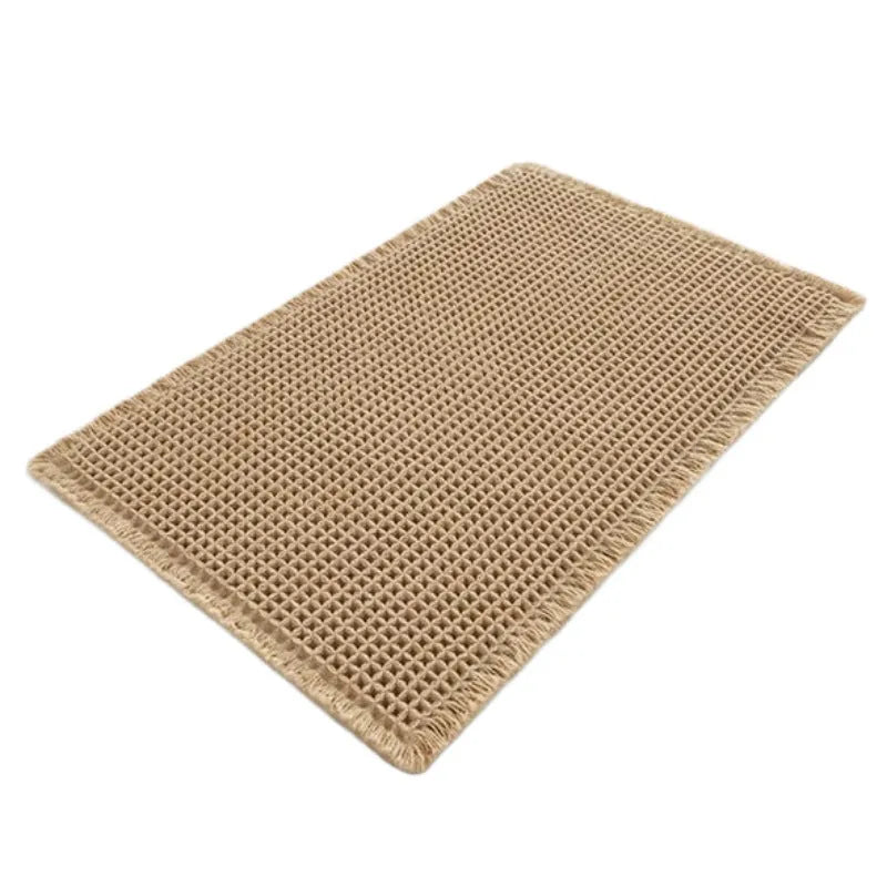 Checkered non-slip polyester bathroom floor carpet in a neutral colour on tiled floor.