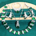 Four-piece bridal zircon jewellery set showing necklace, bracelet, earrings, and ring in a choice of colours.