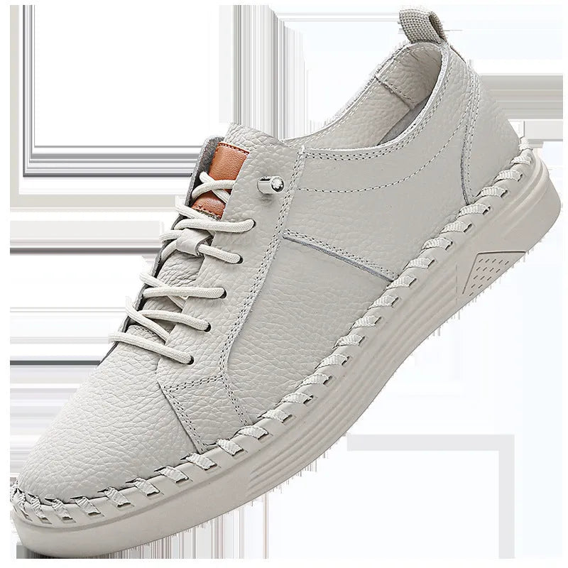 Men's beige and black cowhide leather sneakers with mesh lining and round toe.