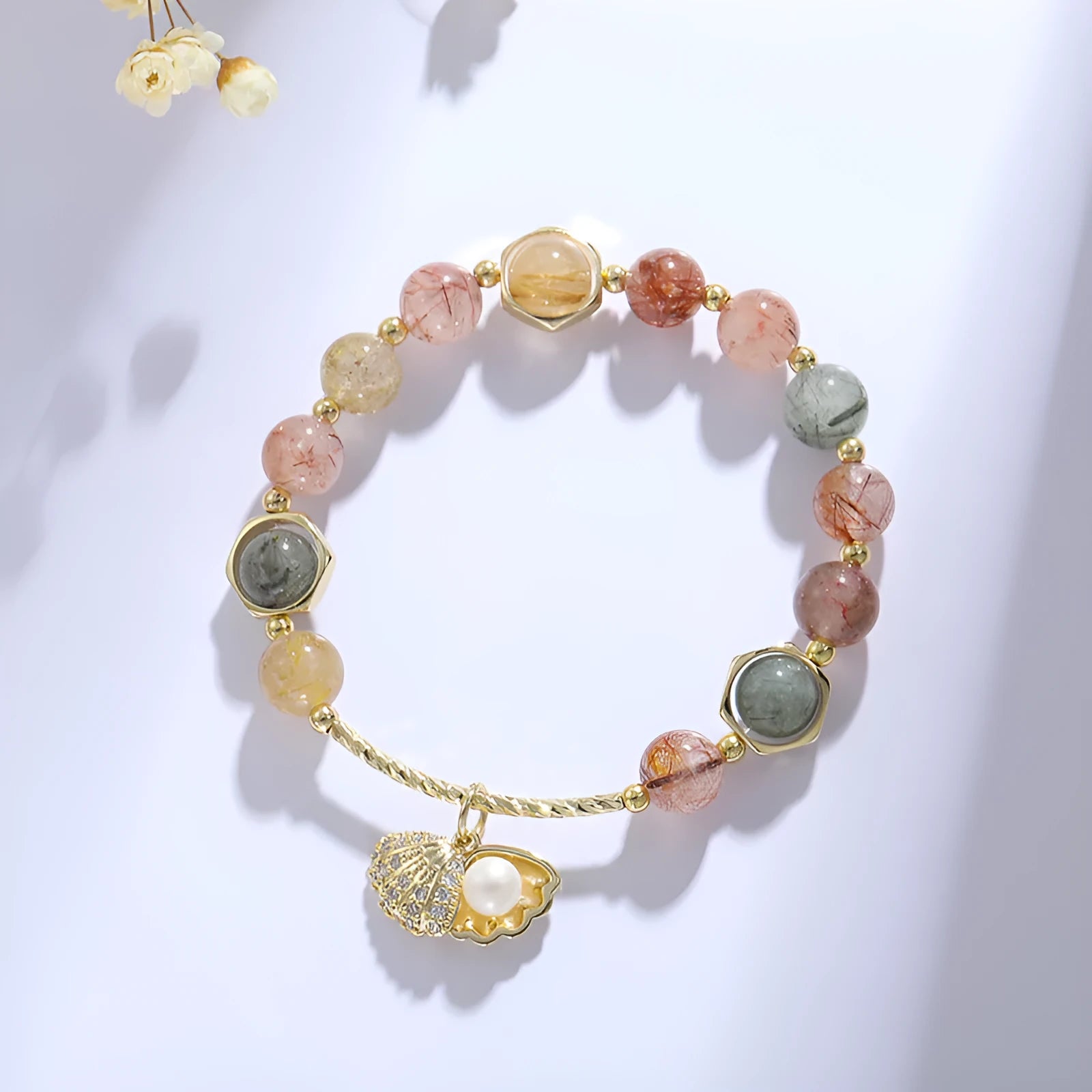 Women's crystal bracelet with coloured hair crystal shells and red sealant flower shells on wrist